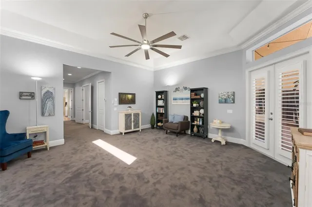 a spacious bathroom with a tub sink and mirror