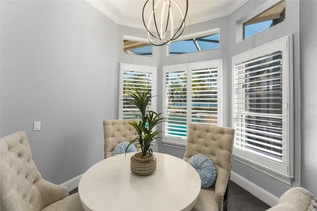a bathroom with a granite countertop tub a sink and a large mirror