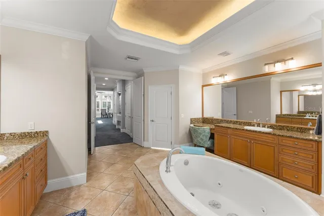 a view of an empty room with a chandelier