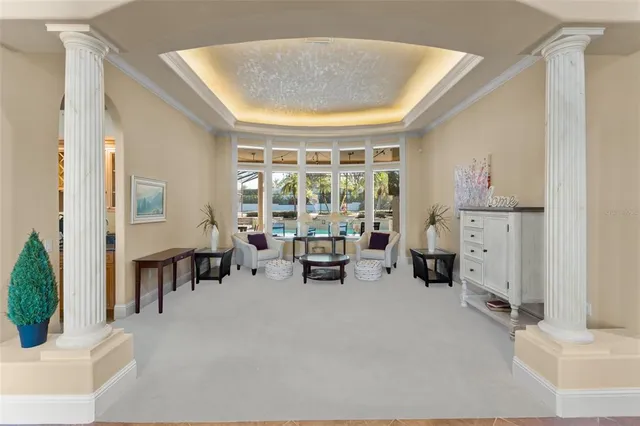 a kitchen with cabinets and chairs