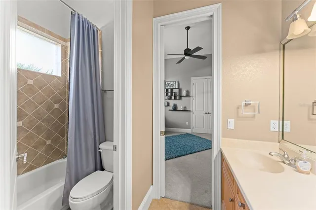 a view of a bedroom with furniture and windows