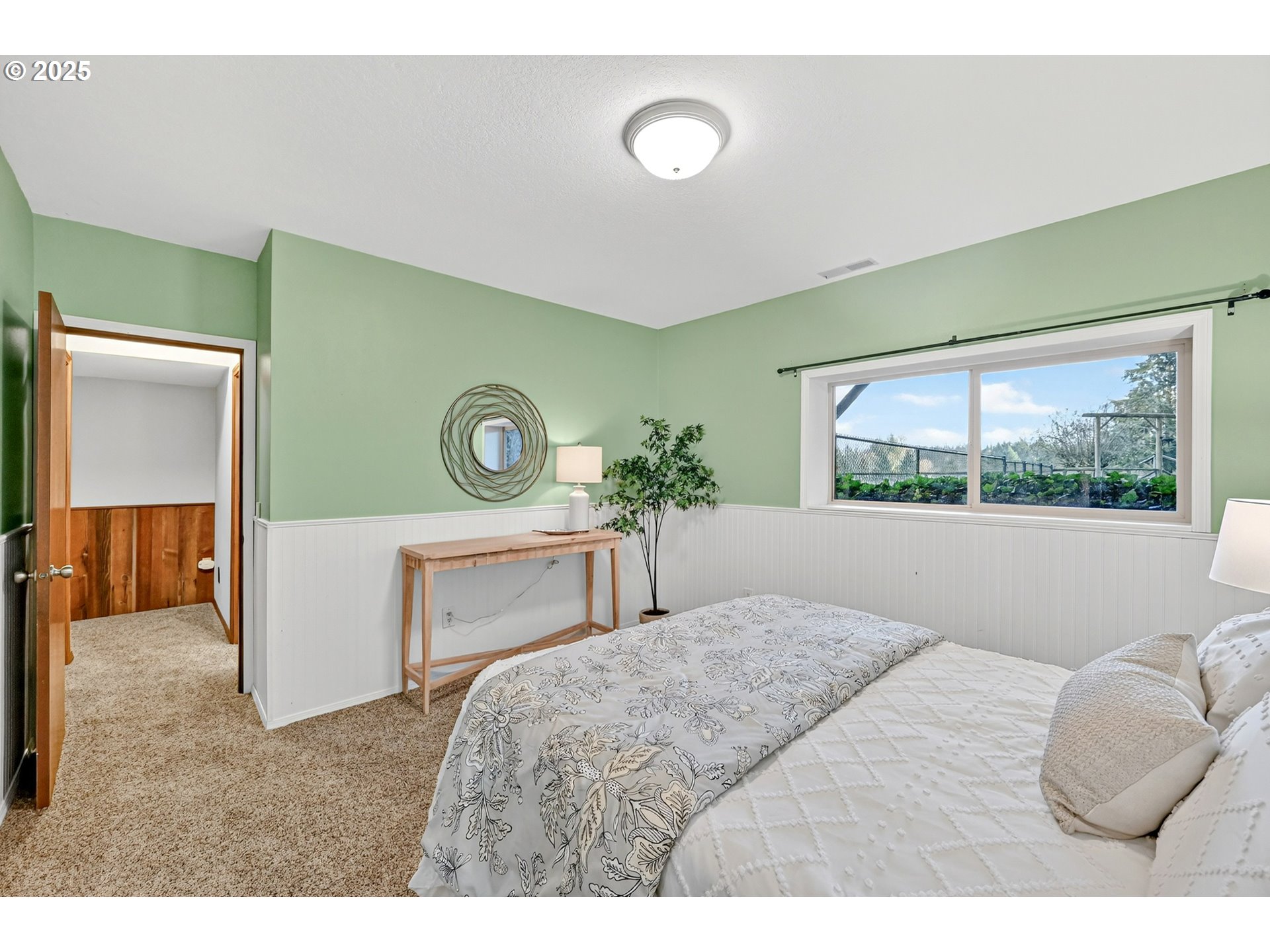 37902 Southeast Porter Road Estacada, OR 97023 - Photo 25 of 48 a bedroom with a bed and a painting on the wall