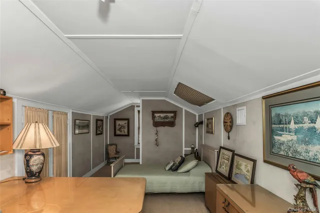 a bedroom with furniture and a window