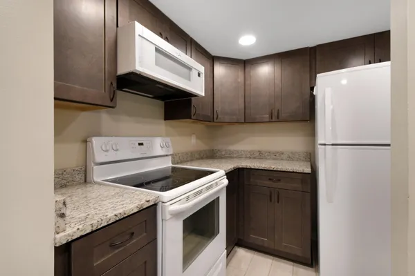 a kitchen with a sink and a refrigerator