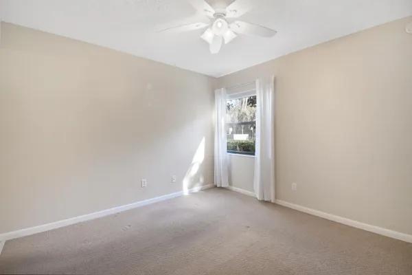 an empty room with a view of a bathroom