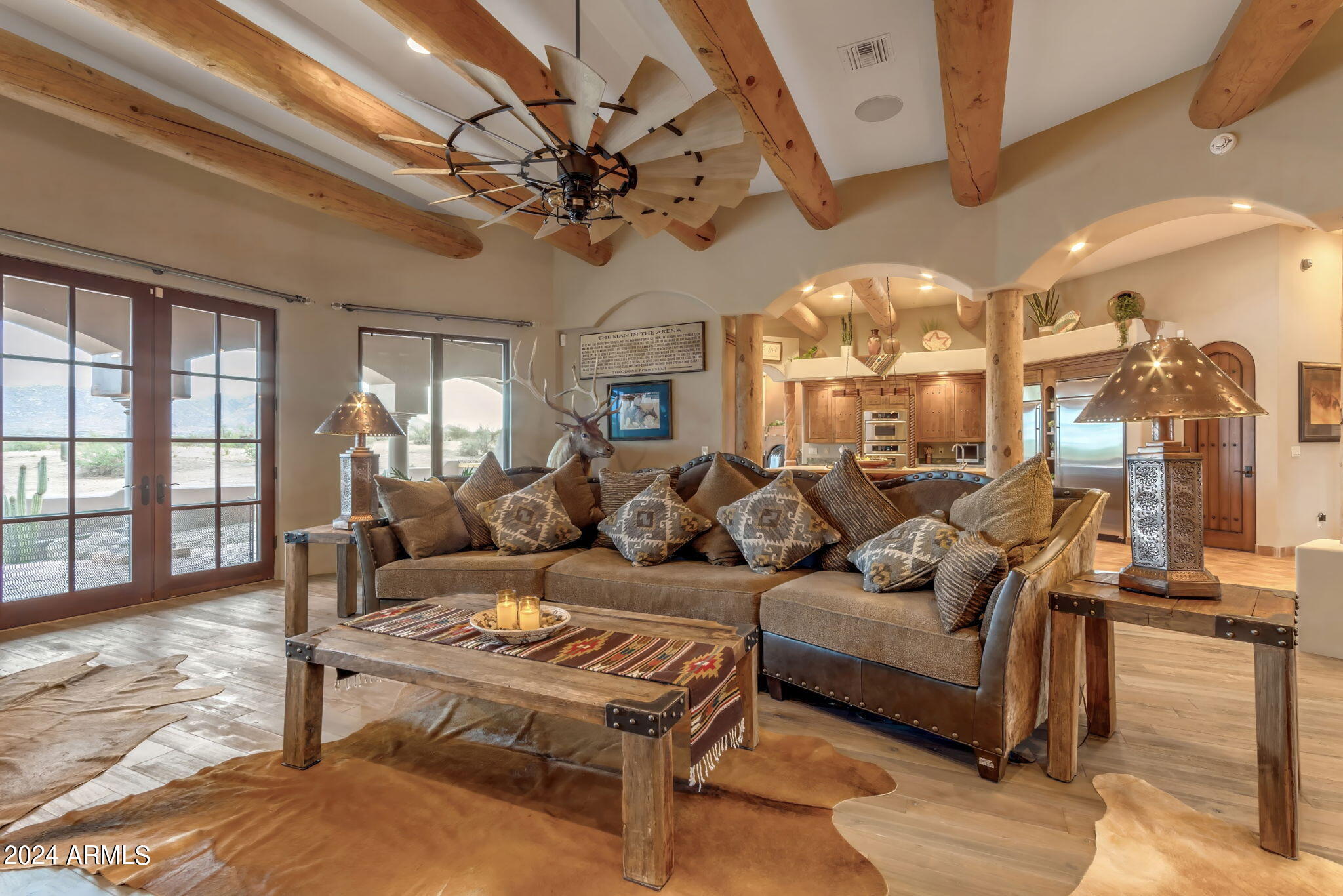 13330 East Jomax Road Scottsdale, AZ 85262 - Photo 104 of 164 a living room with furniture a chandelier and a dining table
