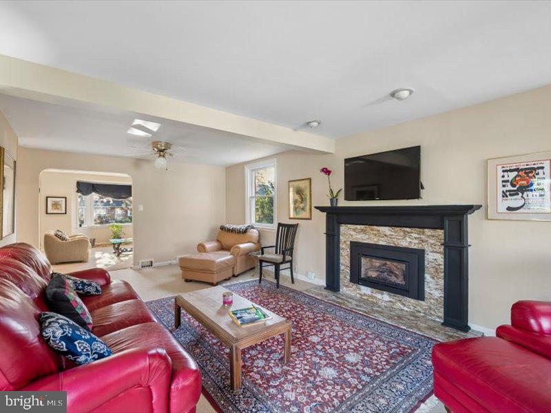1723 Ridgeway Road Havertown, PA 19083 - Photo 11 of 35 a living room with furniture a flat screen tv and a fireplace