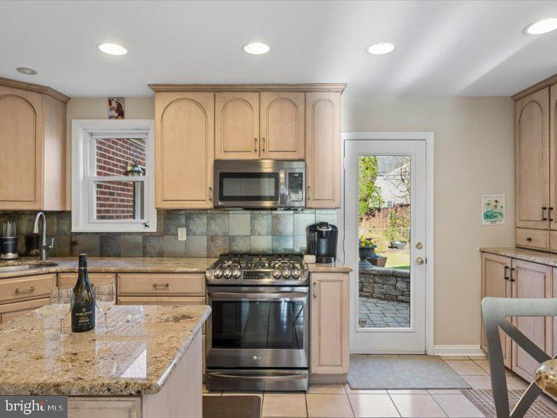 1723 Ridgeway Road Havertown, PA 19083 - Photo 14 of 35 a kitchen with stainless steel appliances granite countertop a stove a sink and a microwave