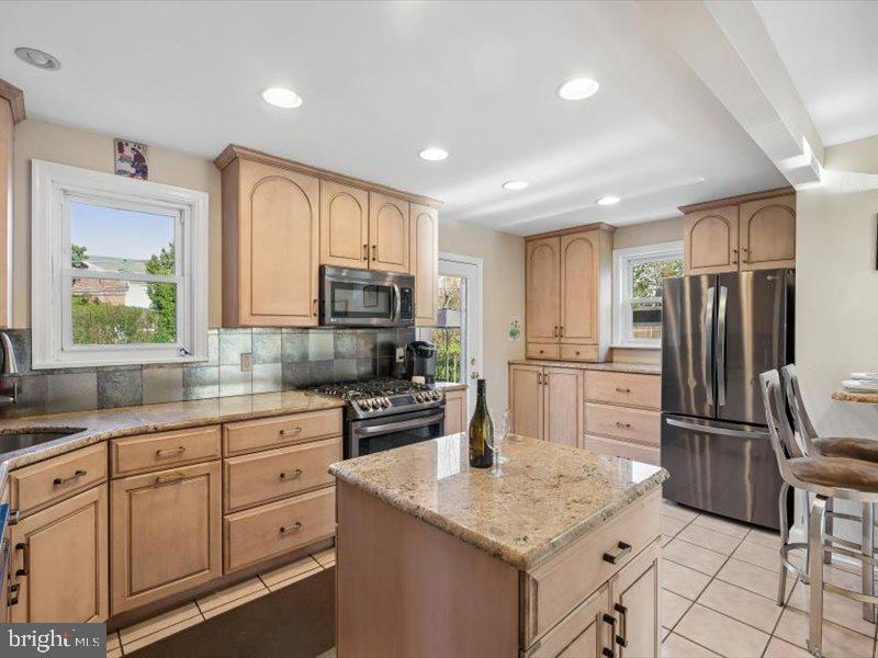 1723 Ridgeway Road Havertown, PA 19083 - Photo 15 of 35 a kitchen with white cabinets and stainless steel appliances