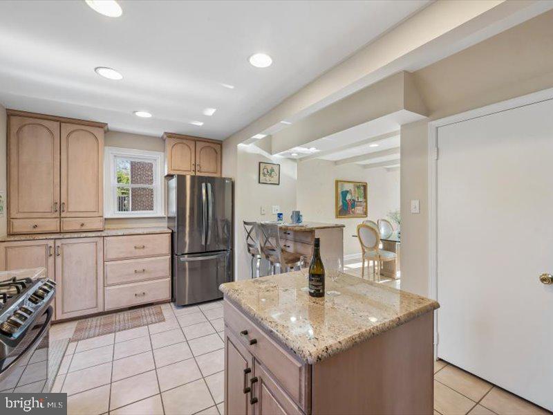 1723 Ridgeway Road Havertown, PA 19083 - Photo 17 of 35 a kitchen with a sink a stove a refrigerator and cabinets