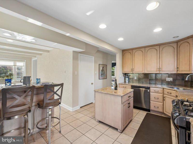 1723 Ridgeway Road Havertown, PA 19083 - Photo 18 of 35 a kitchen with stainless steel appliances kitchen island granite countertop a sink and cabinets