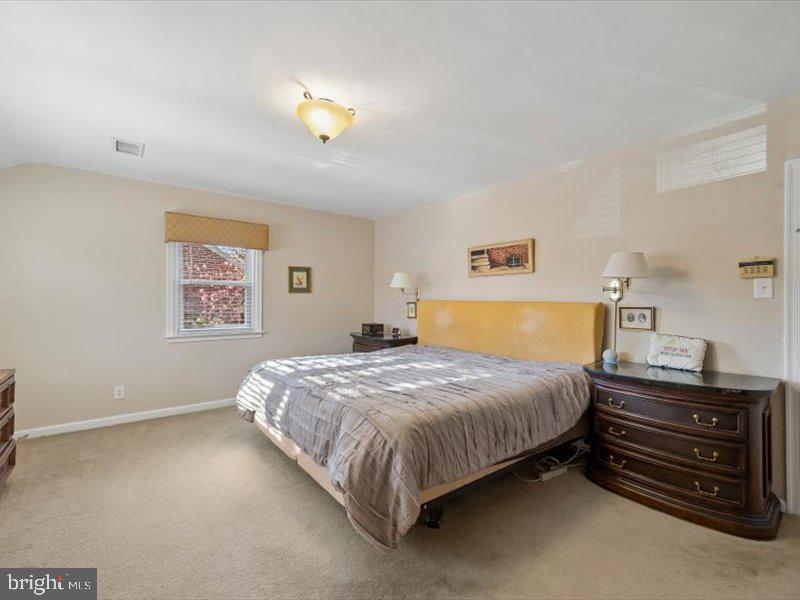 1723 Ridgeway Road Havertown, PA 19083 - Photo 24 of 35 a bedroom with a bed and a chandelier