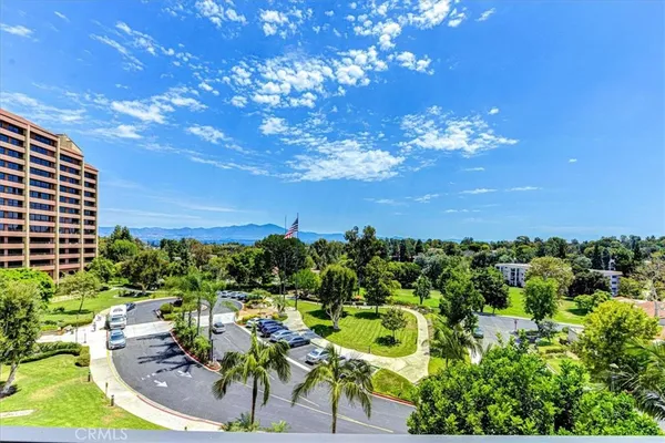 a view of a swimming pool with a yard