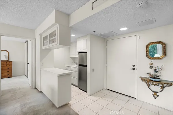 a view of a hallway with bathroom