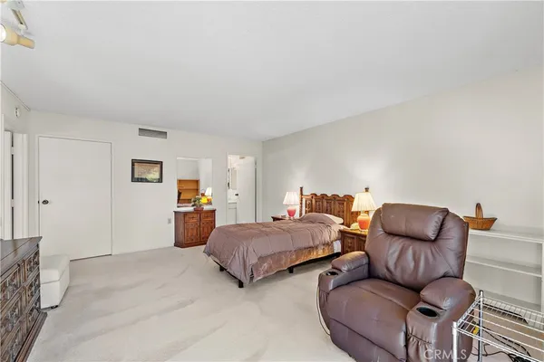 a bedroom with furniture and a couch