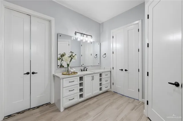 a view of walk in closet with clothes