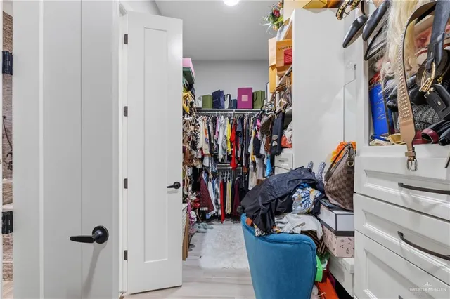 a bedroom with a bed and closet