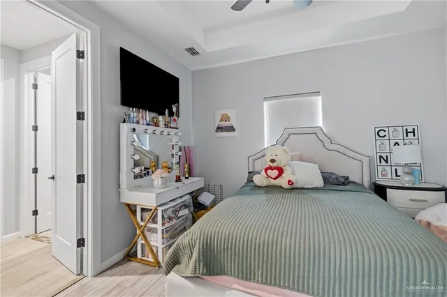 a view of walk in closet with clothes