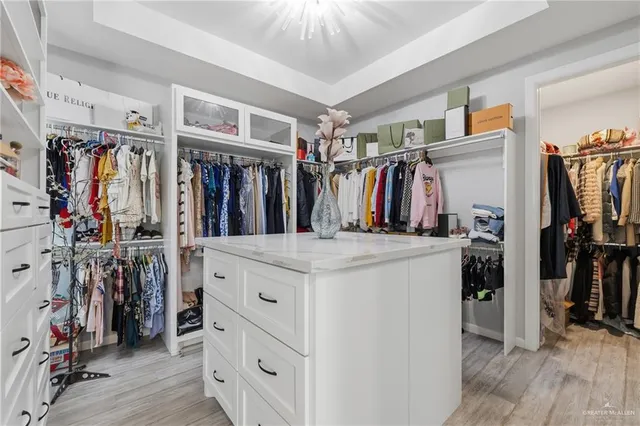 a bathroom with double sink and a mirror