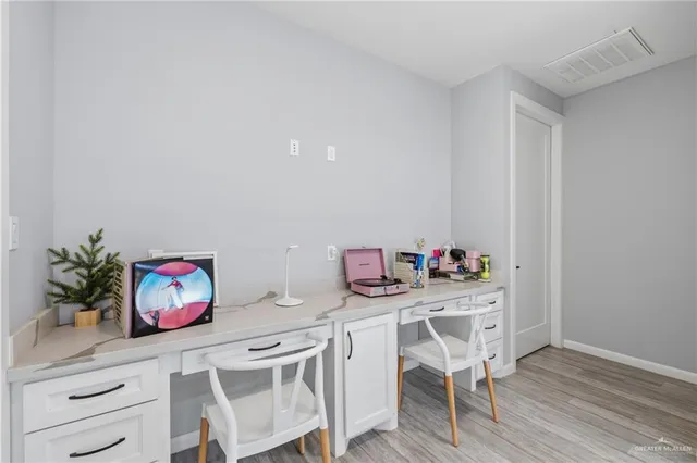 a view of a house with backyard porch and sitting area