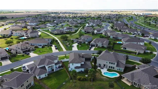 an aerial view of a house with a swimming pool