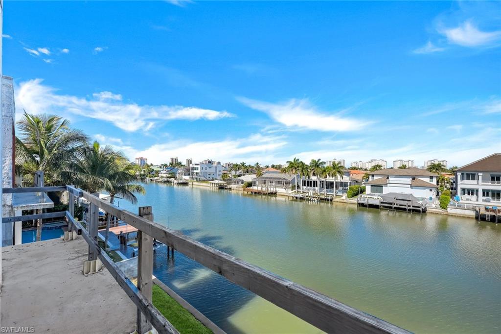 415 Seabee Avenue Naples, FL 34108 - Photo 13 of 32 a view of a lake from a balcony