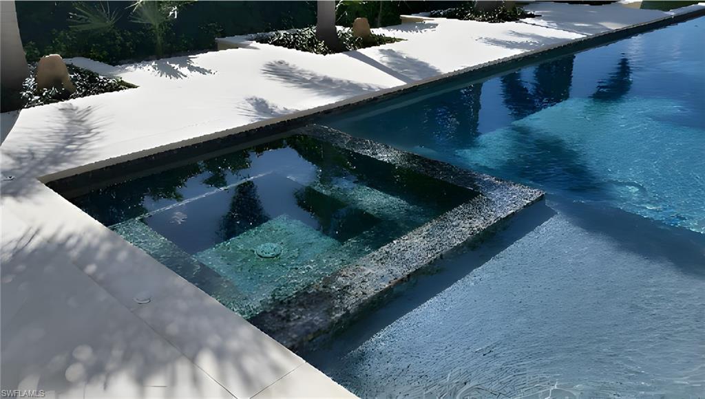 415 Seabee Avenue Naples, FL 34108 - Photo 19 of 32 a kitchen with a sink and a stove