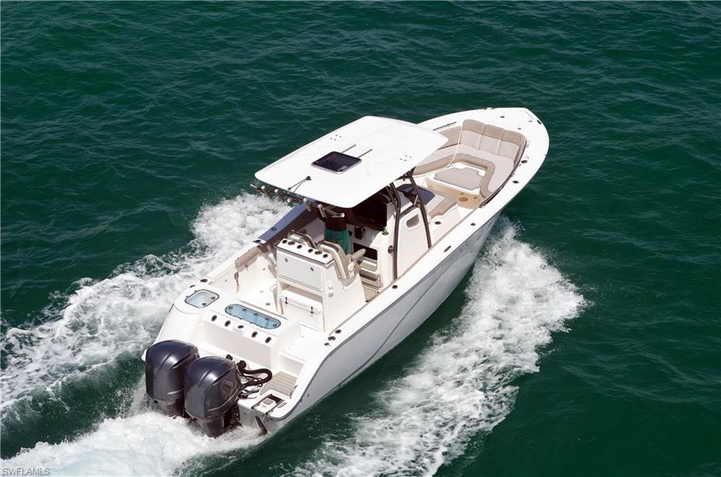 415 Seabee Avenue Naples, FL 34108 - Photo 29 of 32 a view of a backyard with a lake view