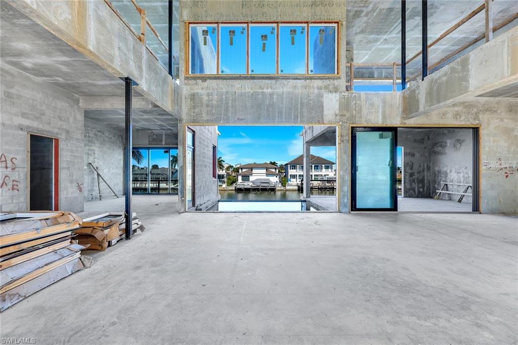415 Seabee Avenue Naples, FL 34108 - Photo 6 of 32 a view of lobby with furniture and a fireplace