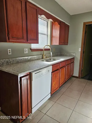 a kitchen with stainless steel appliances a sink and a counter top space