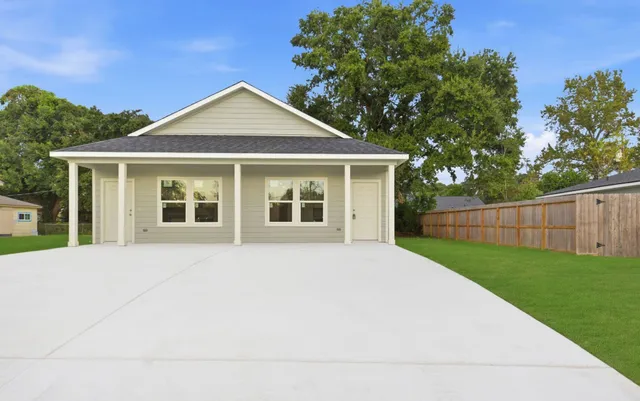 a front view of a house with yard