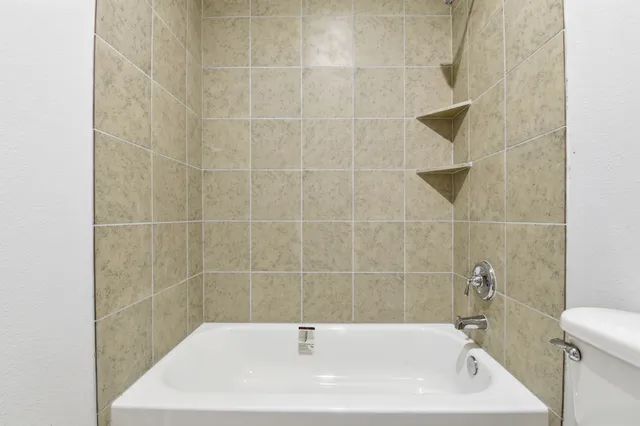 a bathroom with a white bath tub