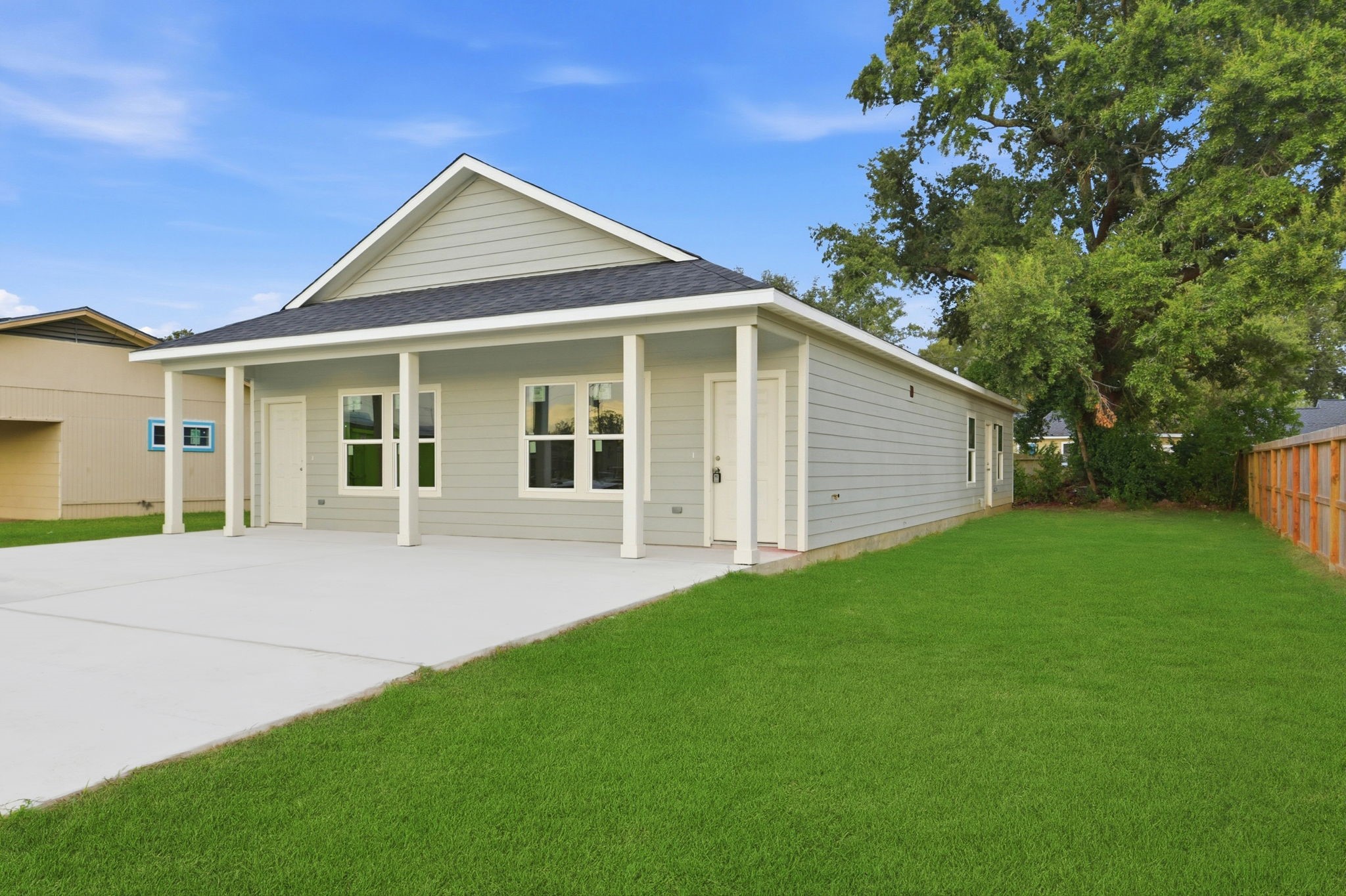 2521 Maple Street, Unit 2521B Liberty, TX 77575 - Photo 2 of 26 a front view of a house with a garden
