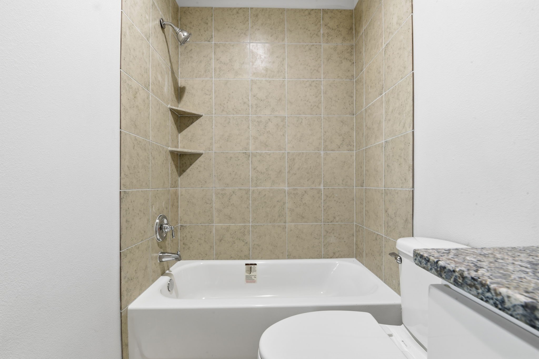 2521 Maple Street, Unit 2521B Liberty, TX 77575 - Photo 23 of 26 a bathroom with a sink a toilet and shower