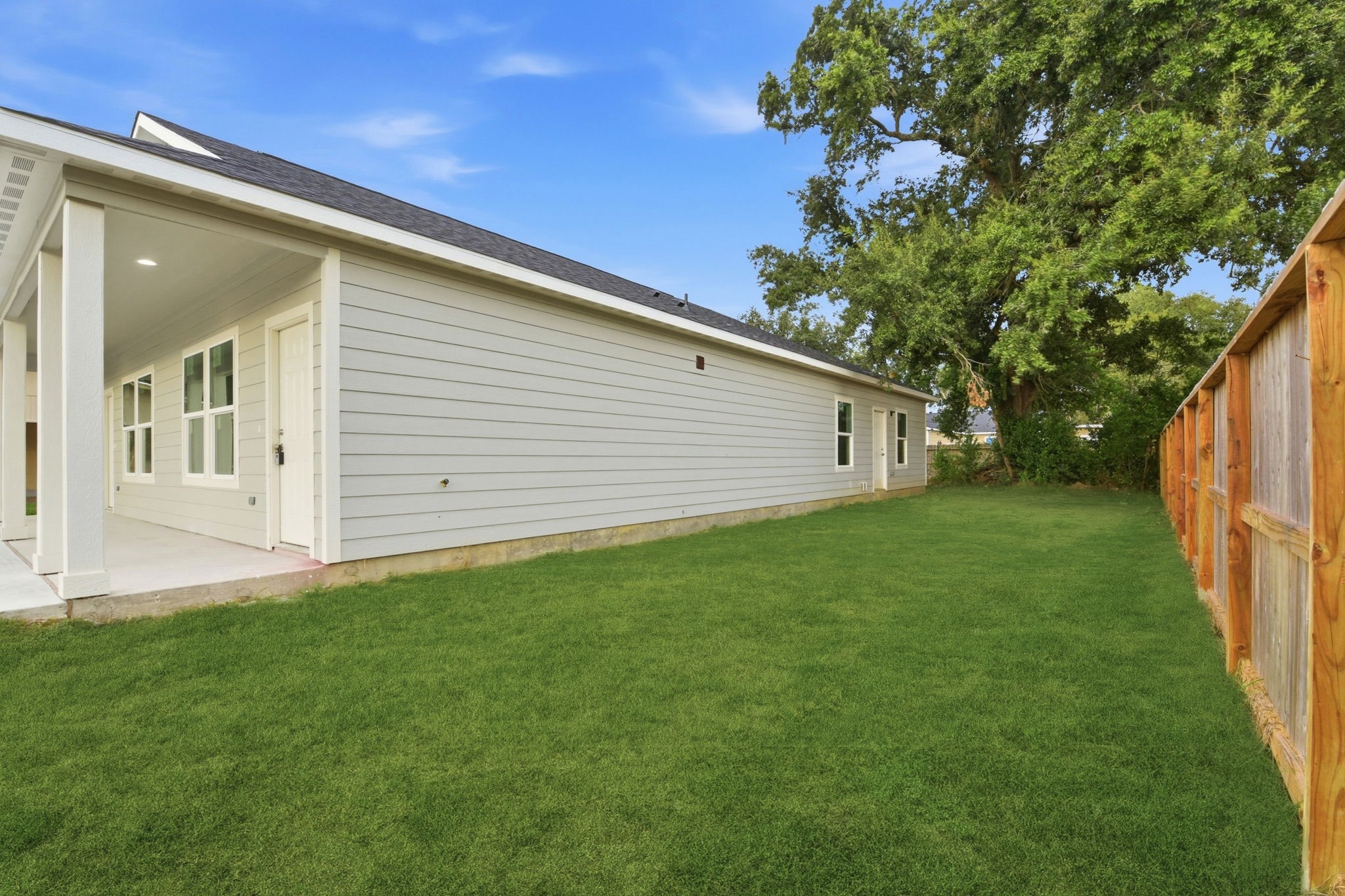 2521 Maple Street, Unit 2521B Liberty, TX 77575 - Photo 25 of 26 a view of a back yard of the house