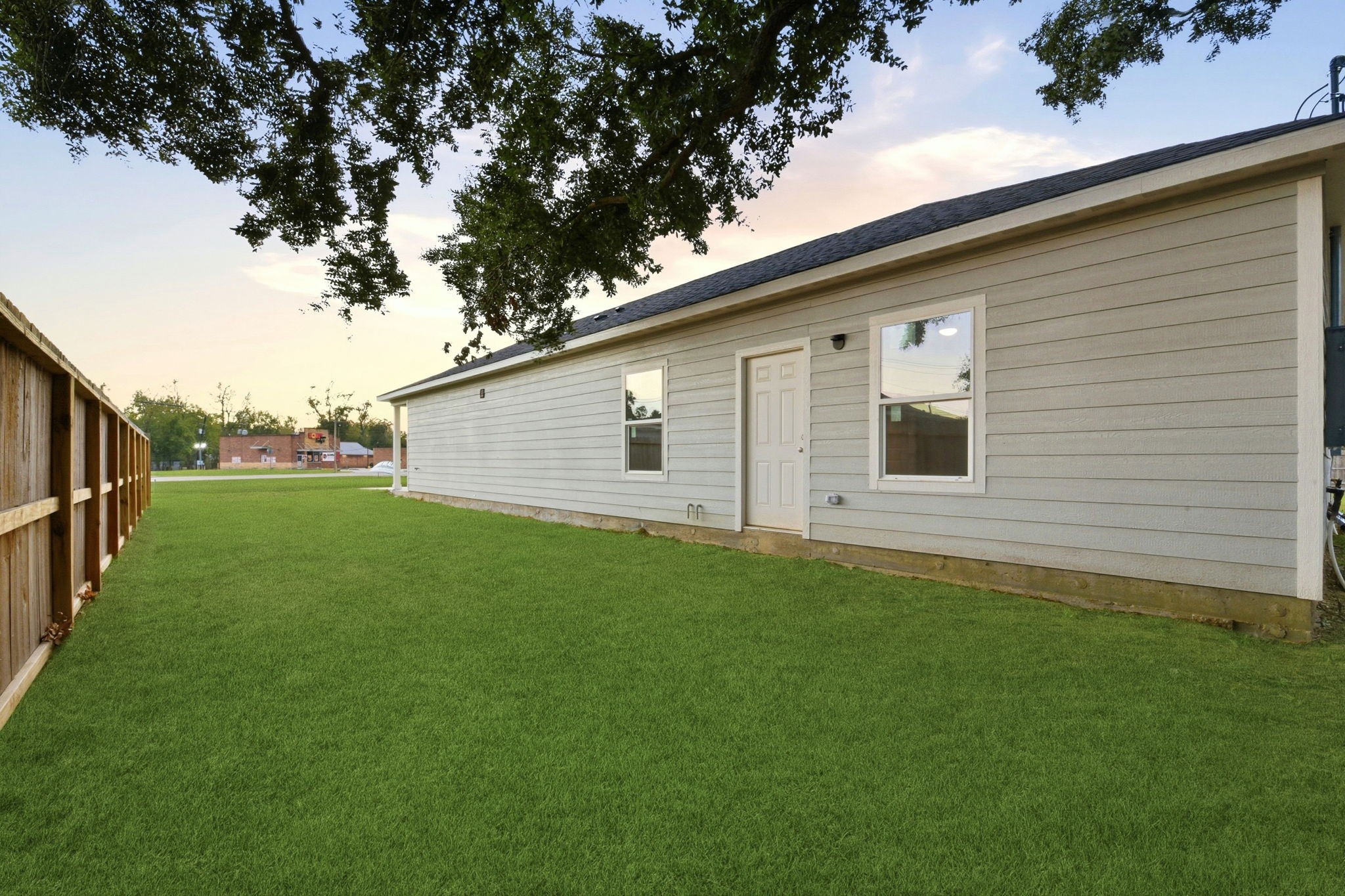 2521 Maple Street, Unit 2521B Liberty, TX 77575 - Photo 26 of 26 a backyard of a house with lots of green space