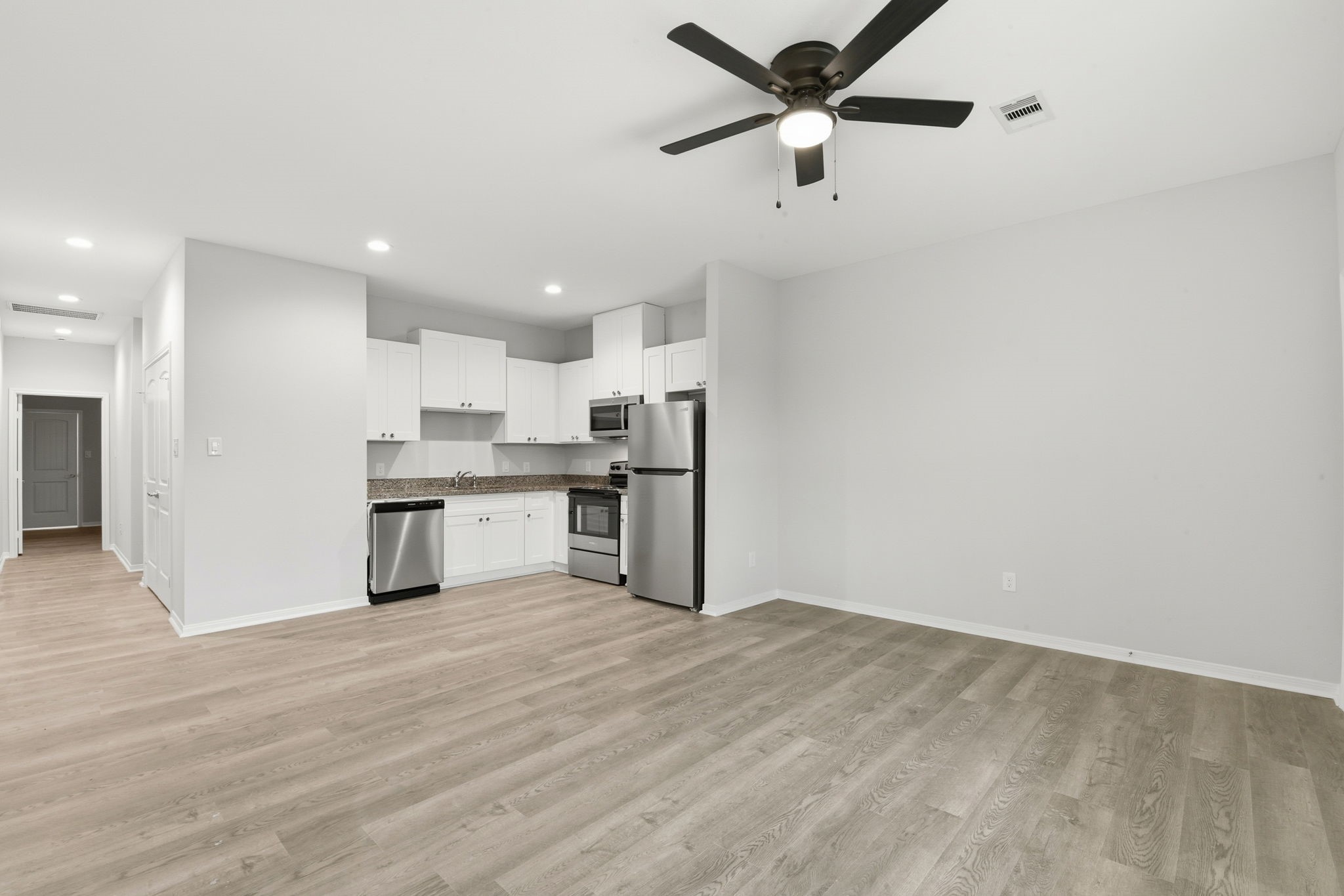 2521 Maple Street, Unit 2521B Liberty, TX 77575 - Photo 8 of 26 a view of kitchen with wooden floor