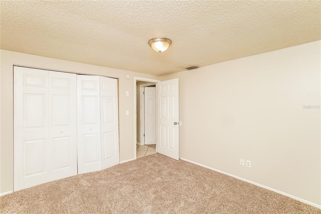 6503 Ridge Crest Drive Port Richey, FL 34668 - Photo 9 of 14 a view of an empty room