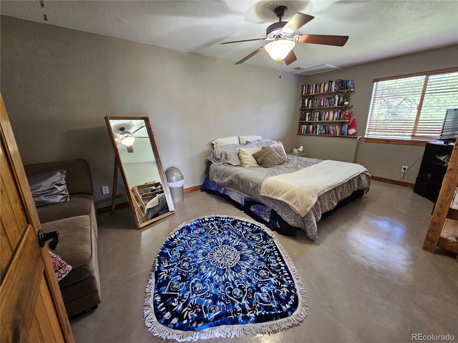 14514 Reserve Road Pine, CO 80470 - Photo 21 of 31 a bedroom with two beds and a window