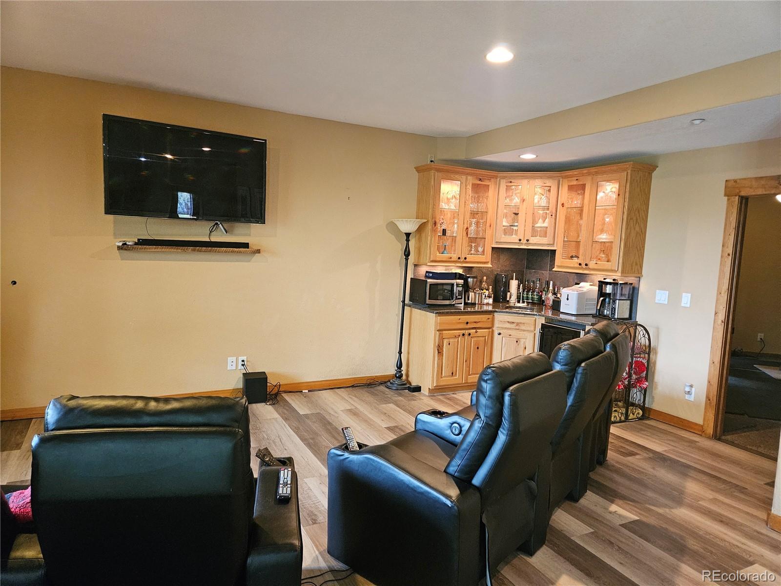 14514 Reserve Road Pine, CO 80470 - Photo 26 of 31 a living room with furniture and a flat screen tv