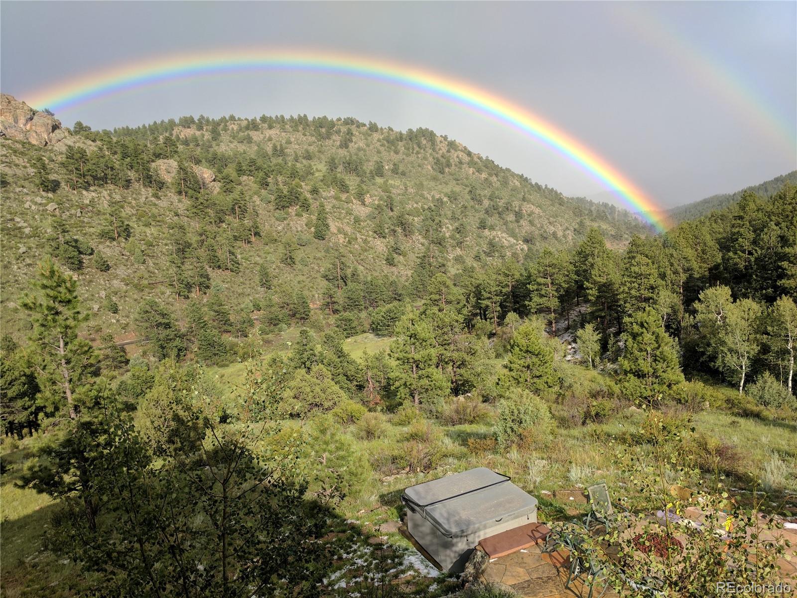 14514 Reserve Road Pine, CO 80470 - Photo 31 of 31 a view of a city with lush green forest