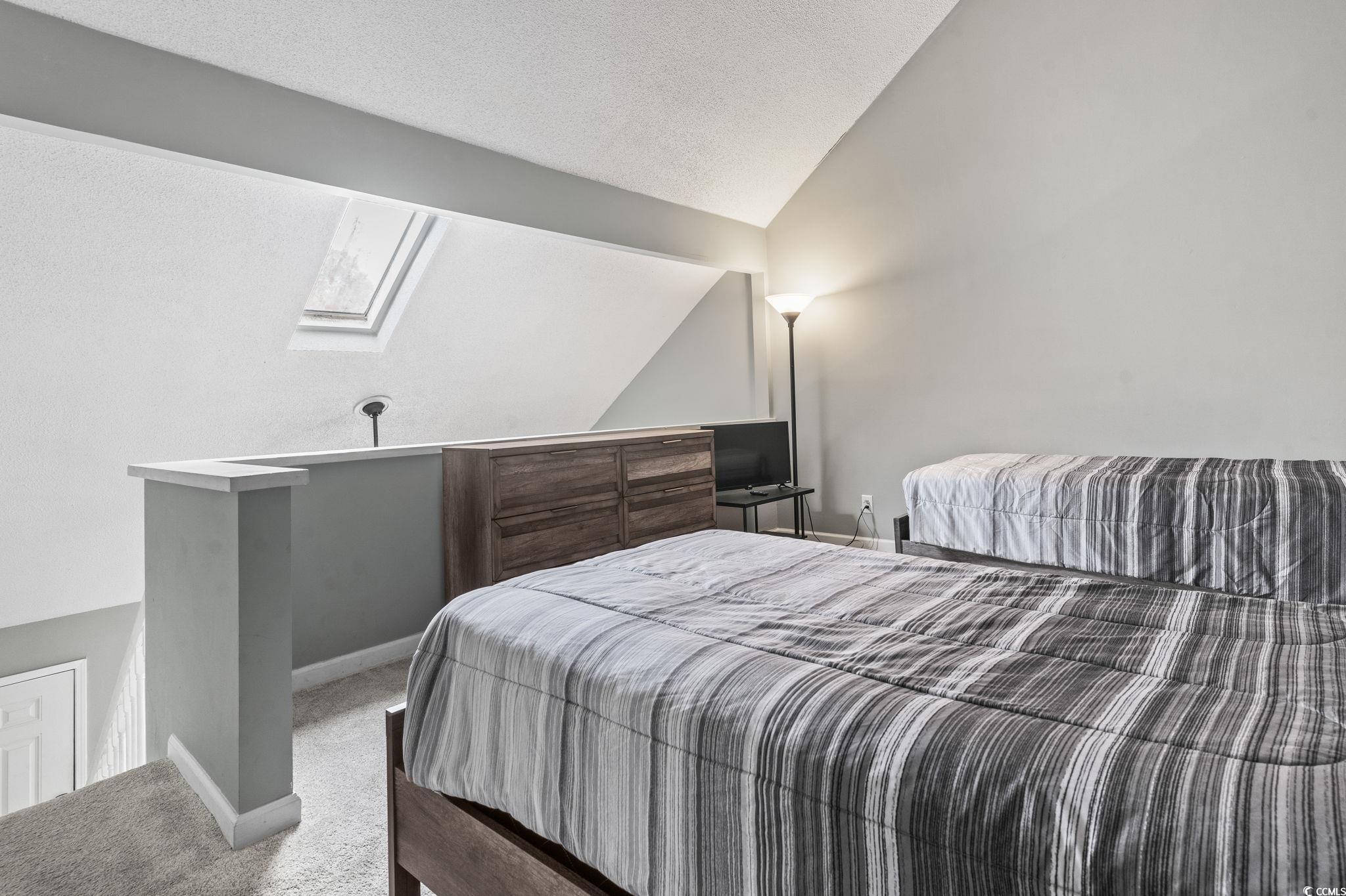 416 Cambridge Circle, Unit H5 Murrells Inlet, SC 29576 - Photo 23 of 28 Living room featuring a towering ceiling, light co