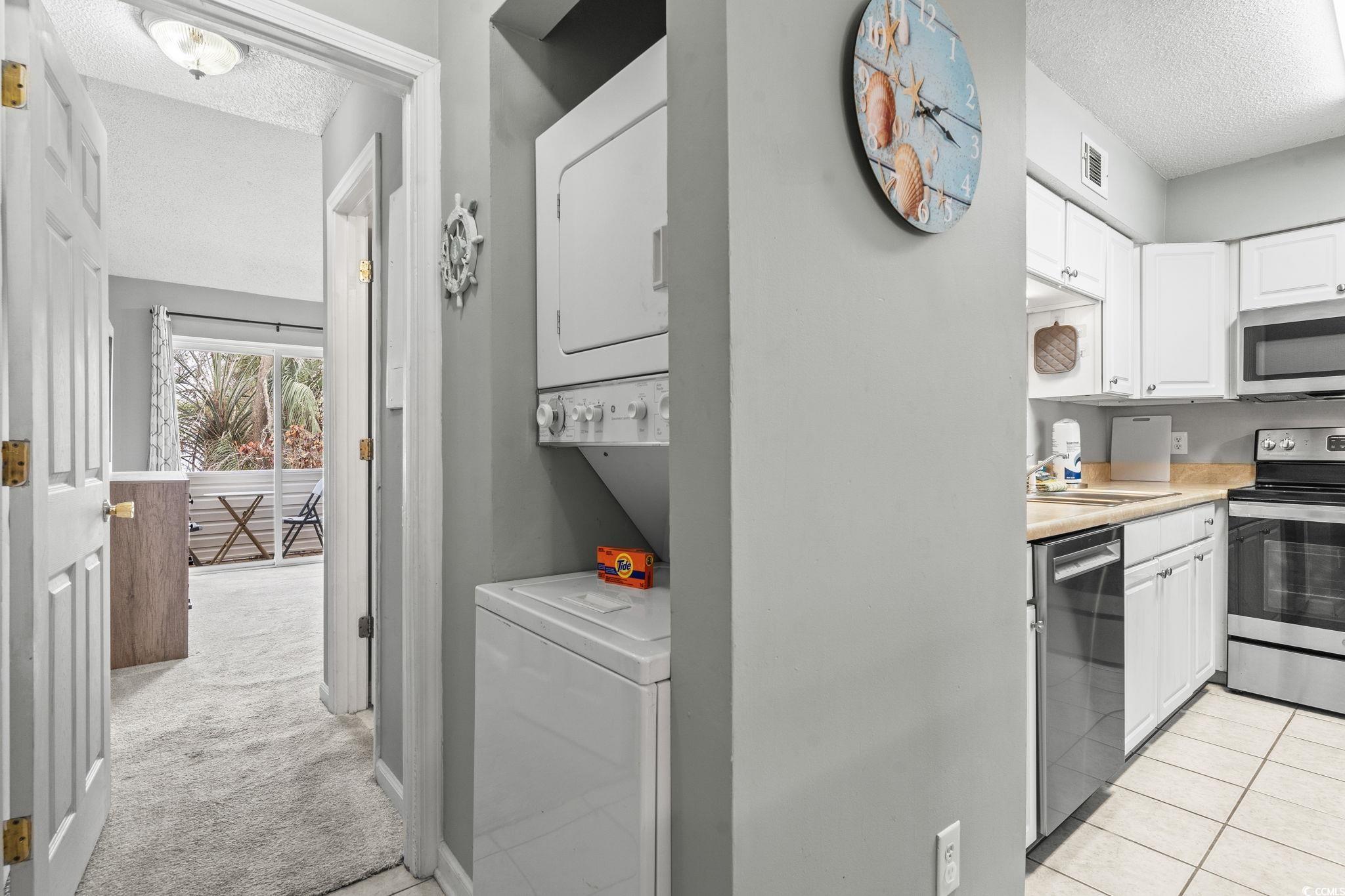 416 Cambridge Circle, Unit H5 Murrells Inlet, SC 29576 - Photo 6 of 28 Tiled living room with ceiling fan, lofted ceiling