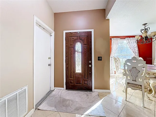 a view of livingroom with furniture and front door
