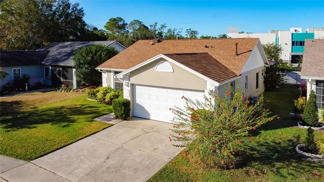 a aerial view of a house with a yard