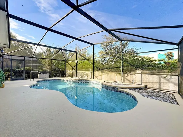 a view of a swimming pool with a patio