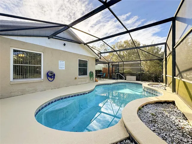 a view of roof deck with table and chairs