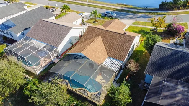 an aerial view of a house with a ocean view