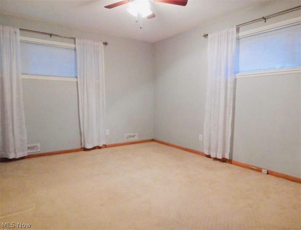 306 Richmond Road Cleveland, OH 44143 - Photo 10 of 17 Carpeted empty room featuring ceiling fan