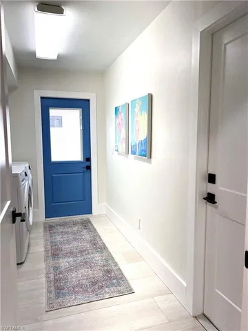 a living room with lots of furniture and a rug